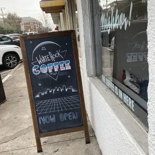 Sandwich board sign, &quot;White Rock Coffee&quot; in 80&apos;s rock ombré font.