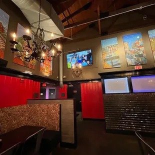 red booths and artwork