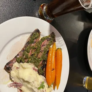 Chimichurri steak, carrots and mashed potatoes.