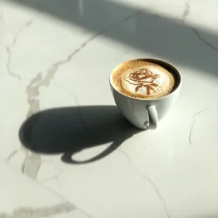 a cup of coffee on a table