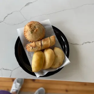 a plate of pastries and a cup of coffee