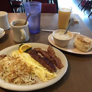 Two eggs scrambled, bacon, hash browns, biscuits and gravy.