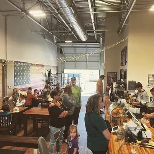 a large group of people sitting at tables