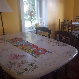 a dining room with a table and chairs