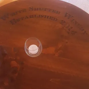 a wine glass on a wooden table
