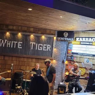a band playing at a bar