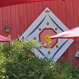 Decor and birdhouses on the adjacent building.