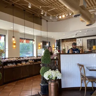 a woman standing in front of the counter