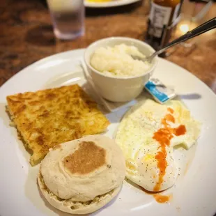 Hungry like the wolf eggs over medium hashbrowns plain grits English muffin.
