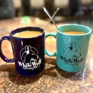 two coffee mugs on a counter