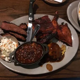 Triple Smoke Platter! BBQ brisket, ribs, and chicken. Mashed potatoes, baked beans, and coleslaw. Portions are huge!!