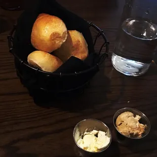 Dinner rolls with butter and a sweet butter(maybe honey or cinnamon?)