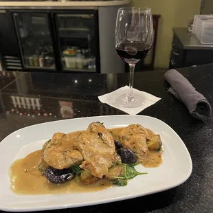 Chicken Medallions with roasted potatoes and sautéed vegetables in lemon butter sauce.