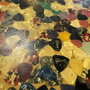 Table has tons of guitar picks 3.10.24