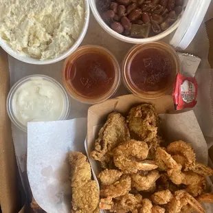 Red snapper, catfish, shrimp and oysters.  Red beans and rice and potato salad. 8/10*