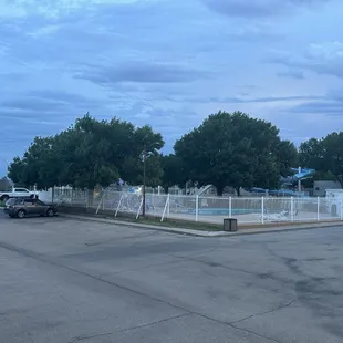 View of the pool and parking lot
