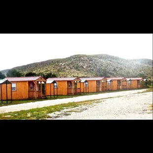 Cabins at $40/night. They have 2 twin beds, carpet, electric outlets, &amp; a wall unit  AC/Heater. The bathrooms &amp; showers across from them.