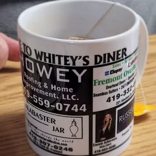 a person holding a coffee mug