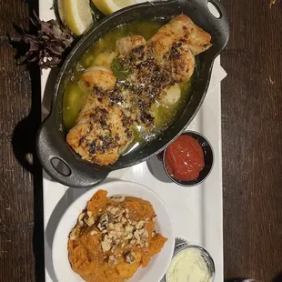 Baked Seafood Combo  A combo of cod fillets, jumbo shrimp, and sea scallops baked in seasoned butter.  And sweet potato casserole.