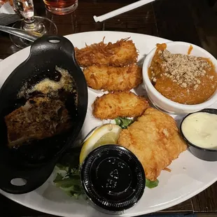 Cod fish dinner. Blackened and baked in seasoned butter, coconut, and original recipe deep fried.  Side of sweet potato casserole.