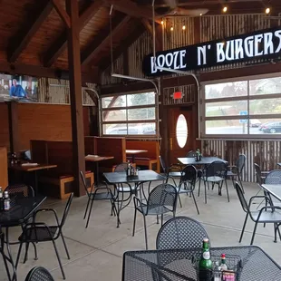 the inside of a restaurant with tables and chairs