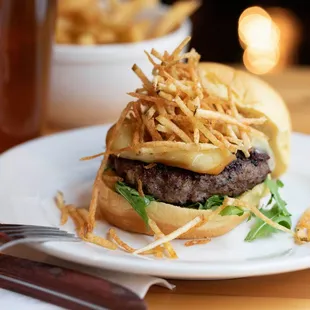 a hamburger and fries on a plate