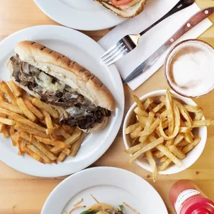 two plates of food on a wooden table