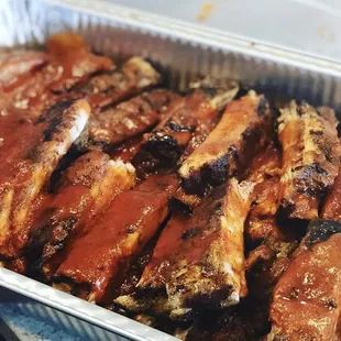 Tender, fall of the bone Whitmore&apos;s signature Barbecue with Family Secret Sauce