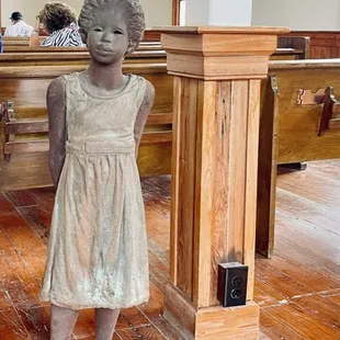 A lil girl in the Antioch Baptist Church