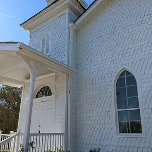 Very unusual scaled siding on the church.
