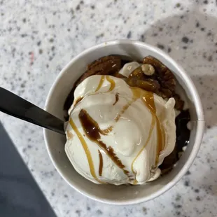 Vanilla custard with hot fudge hot caramel sauce and pecans