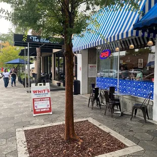 a tree in front of a store
