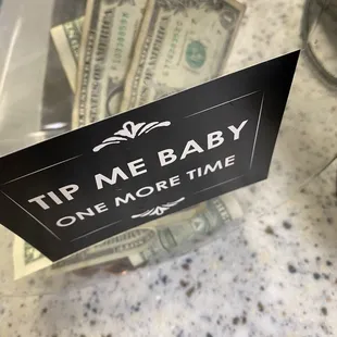 a sign that says tip me baby one more time