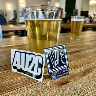 a pint of beer and a sticker