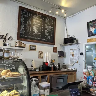 a view of a counter with a variety of pastries