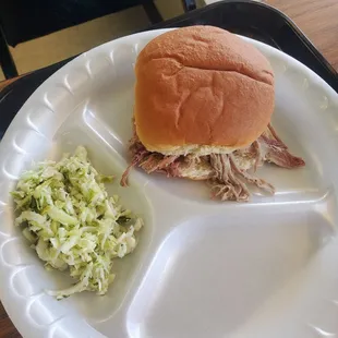 Pulled pork sandwich and slaw on side