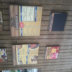 menus on a brick wall