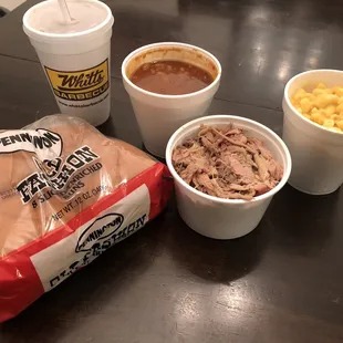 Mac n' cheese, a whole bag of buns and baked beans.