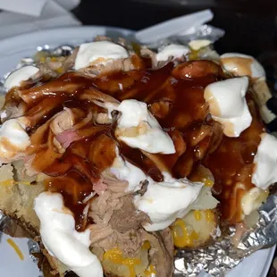 Loaded baked potato ($6 on Thursdays!) this is the finished look when I top with sour cream, a little mild vinegar, and barbecue sauce