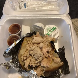 a chicken sandwich in a styrofoam container