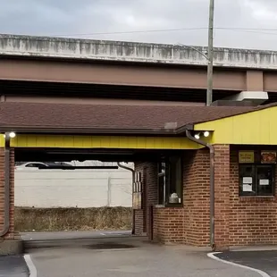 a brick building with a yellow roof