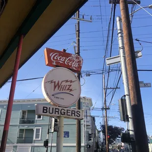 Storefront sign at Whiz Burgers Drive-in in San Francisco.