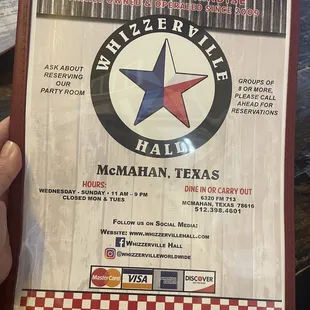 a person holding a menu
