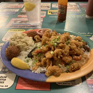 Blackened catfish, Étouffée and fried crawfish tails. With coleslaw and hush puppies. Yummy