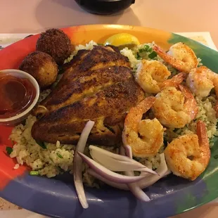 Daily special if grilled red snapper and grilled shrimp with garlic herb rice and hush puppies.