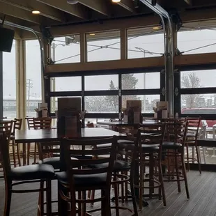 a woman standing at a bar