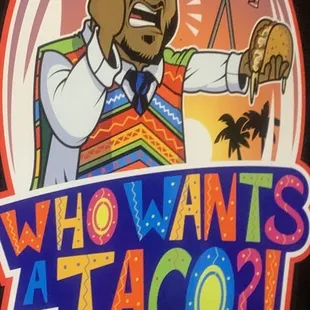 a man holding a taco