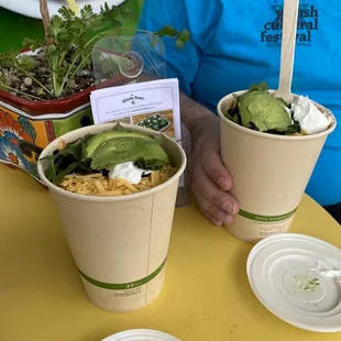 two cups of food on a table