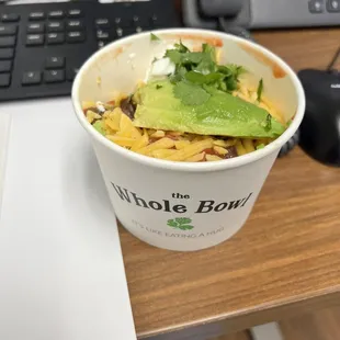 a bowl of food on a desk