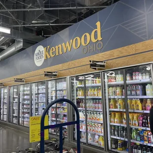 people shopping in a whole foods store